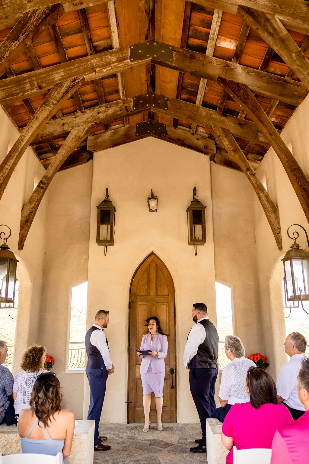two grooms during their elopement ceremony at chapel dulcinea in Austin